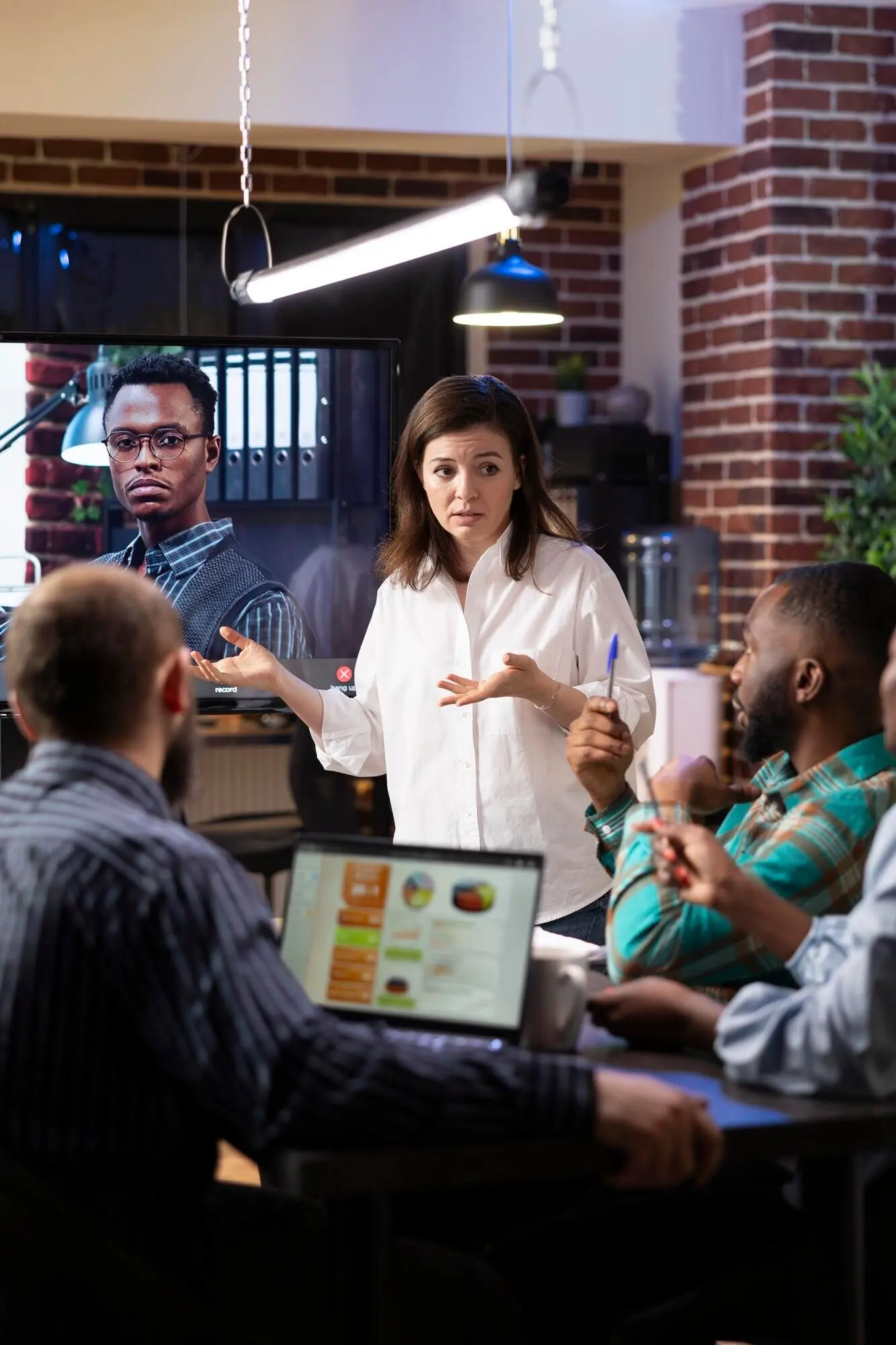 Colleagues taking part in a virtual meeting at the office.