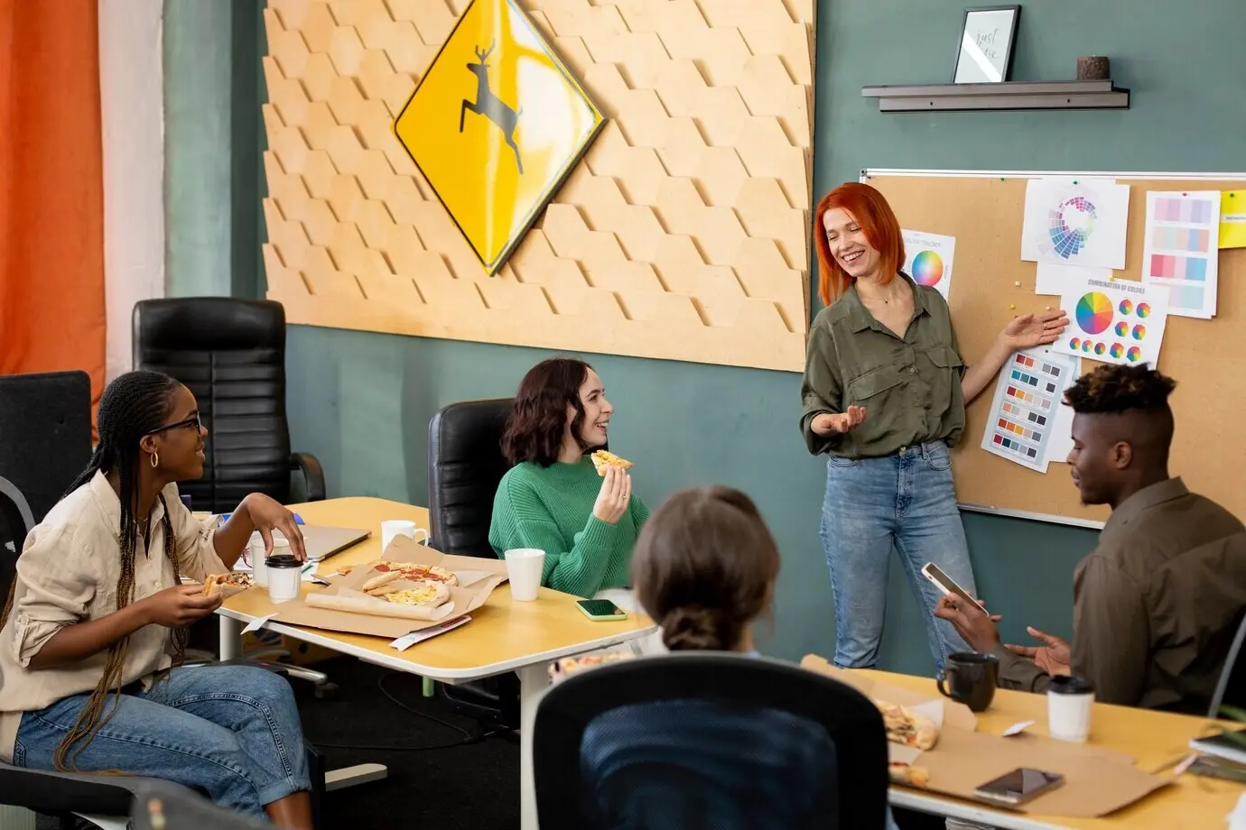 Medium shot of smiling colleagues at a business meeting